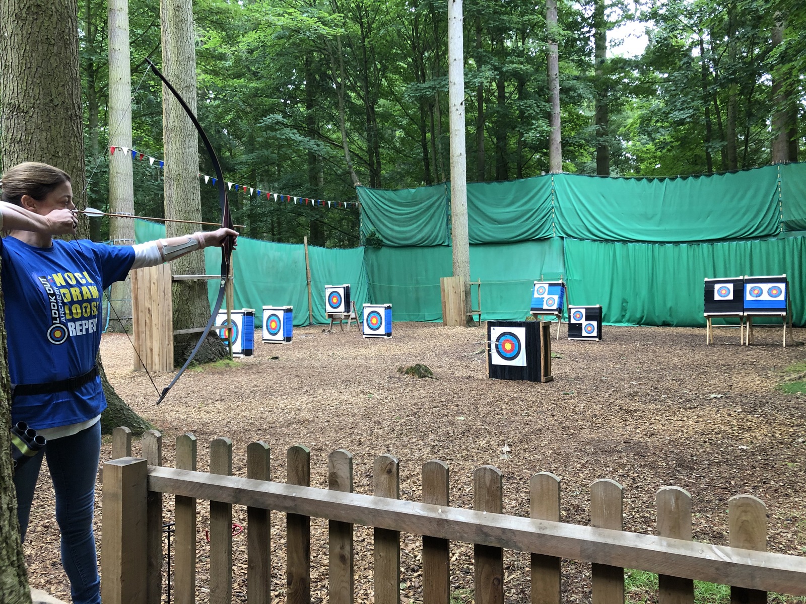 Archer taking aim at outdoor range
